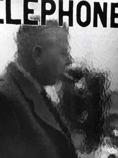 Robert Doisneau - Jacques Prévert in a Telephone Booth