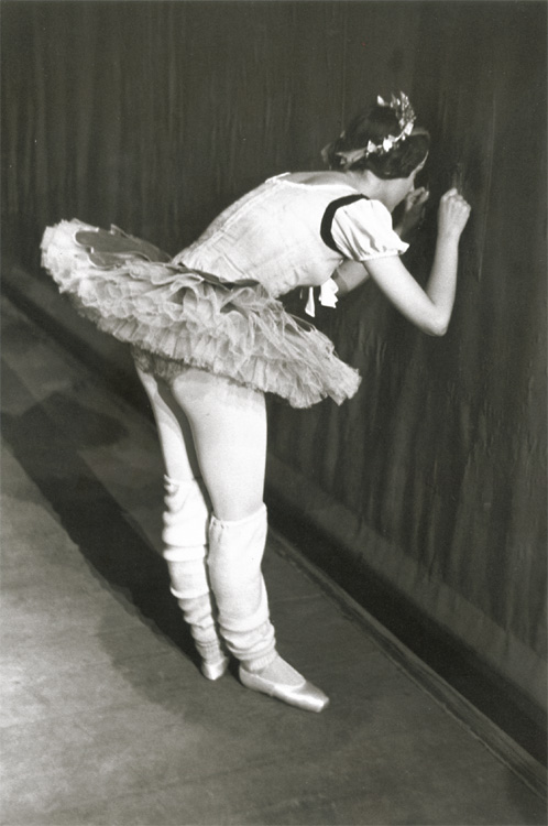 Ballet Dancer Peeking Through Curtain