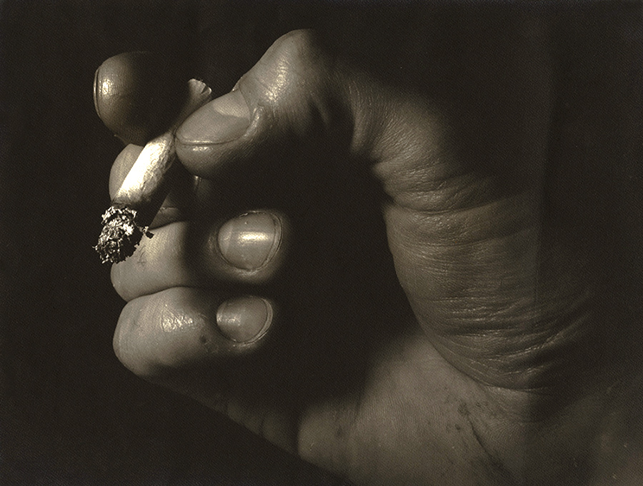 Close-up of a Hand and Cigarette
