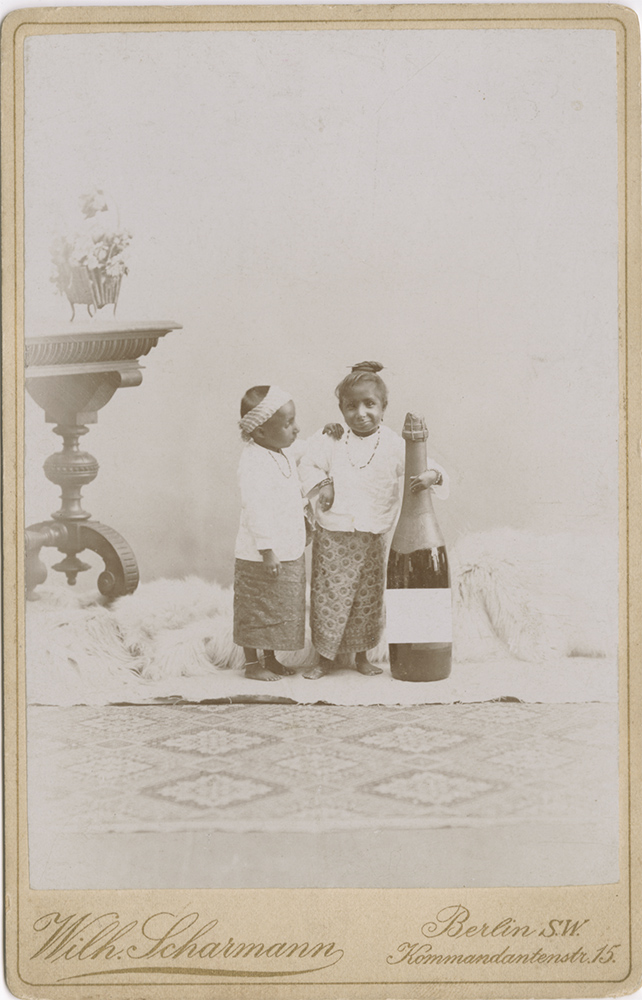 Wilhelm Scharmann - Midget Children with a Large Champagne Bottle