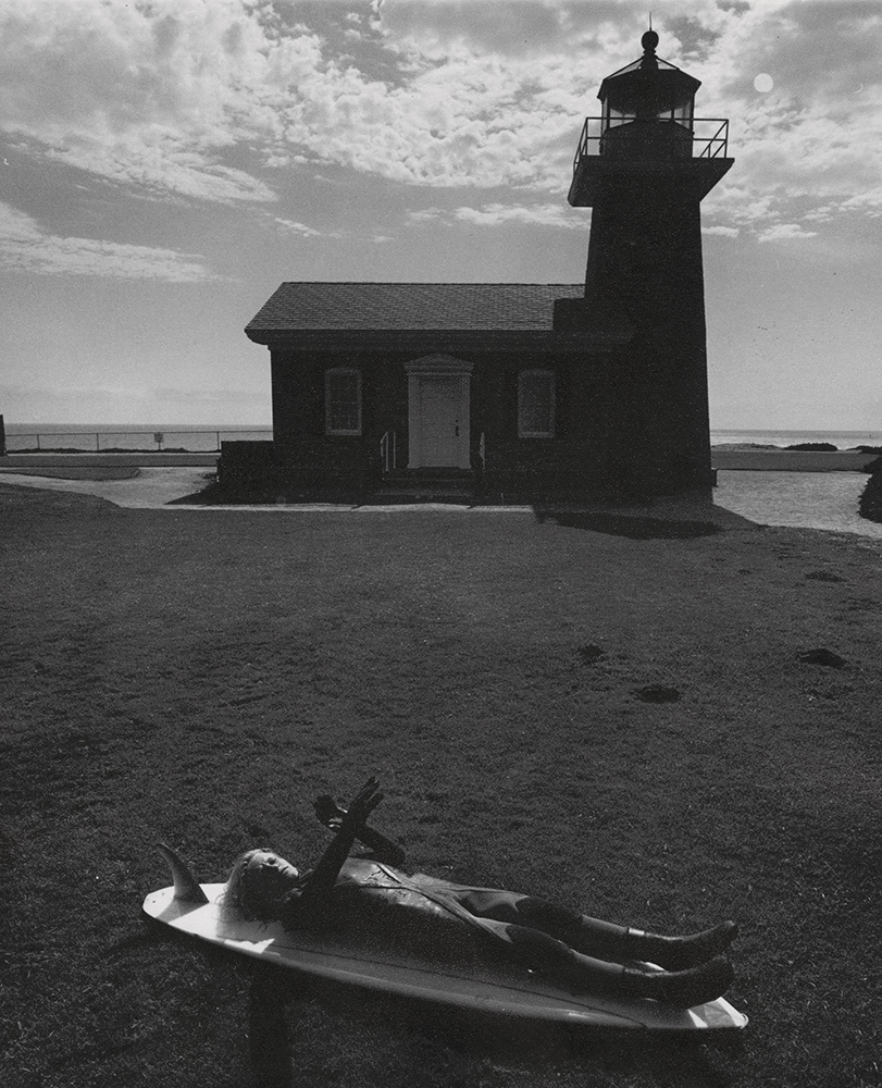 Arthur Tress - Lighthouse with Child Lying on Surfboard (Surfer's Dream)