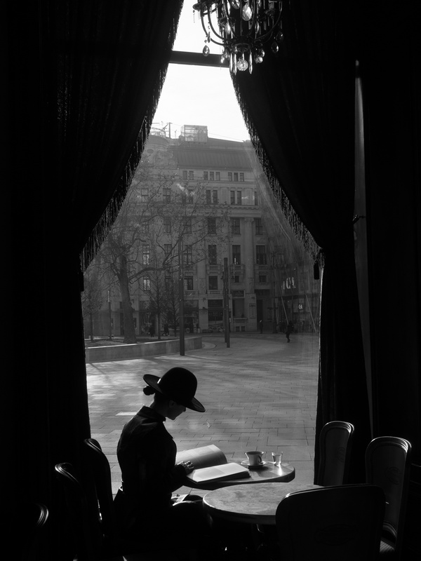 Stanko Abadžic - Woman in Window of Budapest Cafe Reading a Book