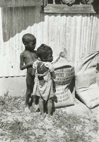 Anonymous - African Children Look in Corn Sacks from the U.S. Anonymous - African Children Look in Corn Sacks from the U.S.