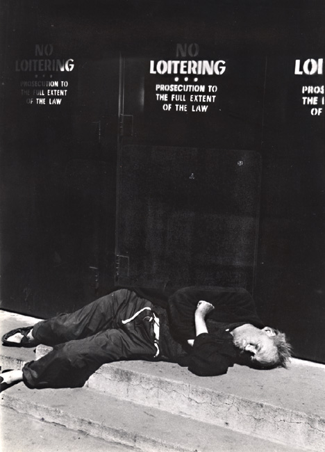 Martin Steingesser - Bum Sleeping under a "No Loitering" sign in New York City, NY