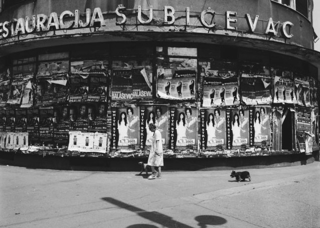 Stanko Abadžic - Old Woman and Dogs in Front of Posters