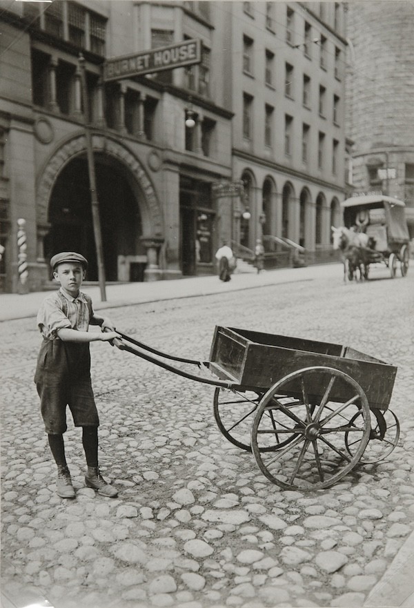 Lewis W Hine, (A Part-time Office and Delivery Boy on cobblestone road in front of Burnet House building) , circa 1920's ,Vintage Gelatin Silver Print. Lewis W Hine, (A Part-time Office and Delivery Boy on cobblestone road in front of Burnet House building) , circa 1920's ,Vintage Gelatin Silver Print.